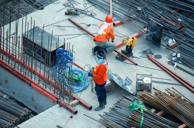 Construction workers on a site with materials and equipment — suggested image — client to supply the final photograph