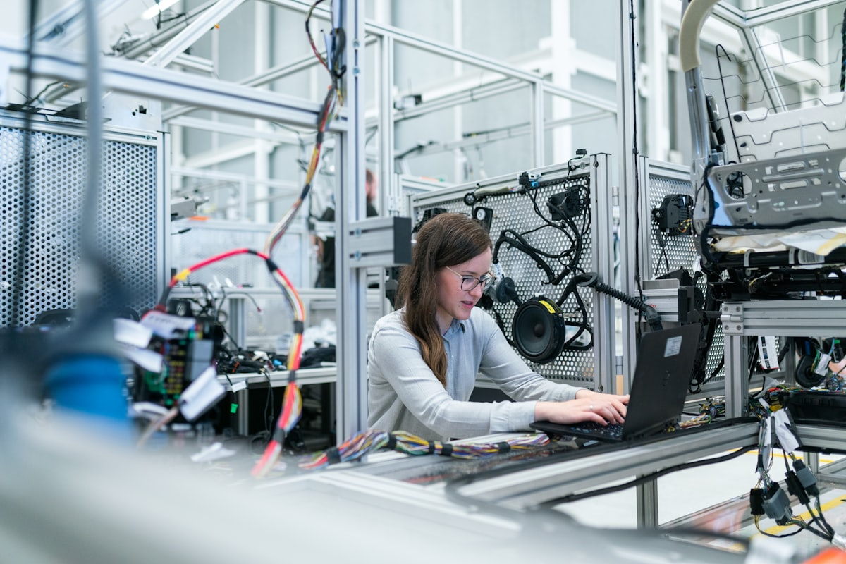 A technician working at a laboratory bench with test equipment